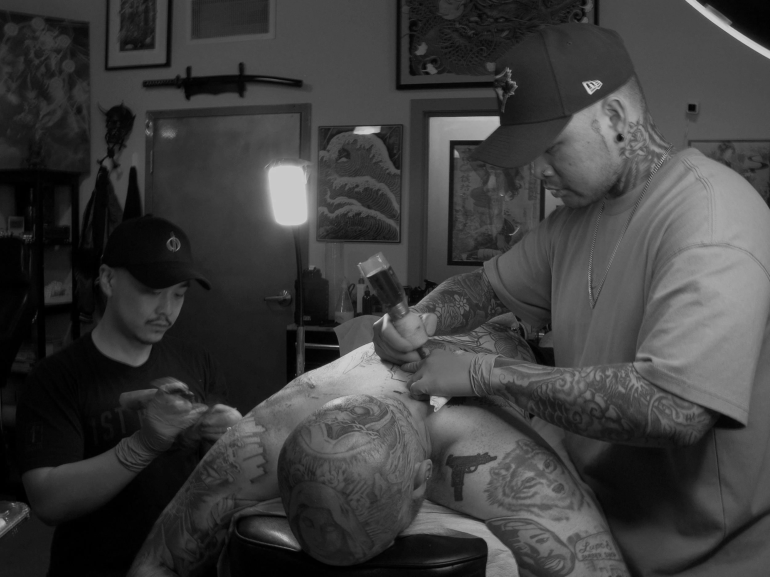 Tattoo artist at work in a professional studio in Vancouver