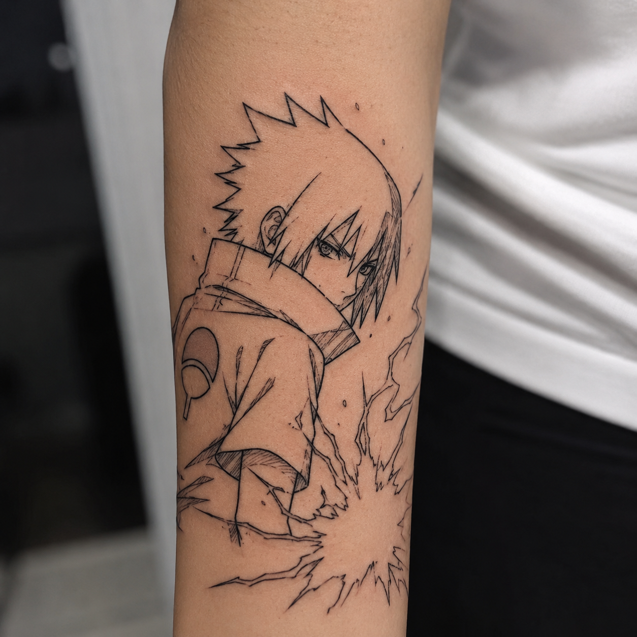 Black linework tattoo on forearm showing good tattoo longevity